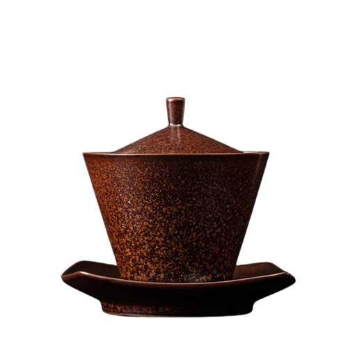 A brown ceramic Gai Wan with a lid and a handle, placed on a matching brown saucer.