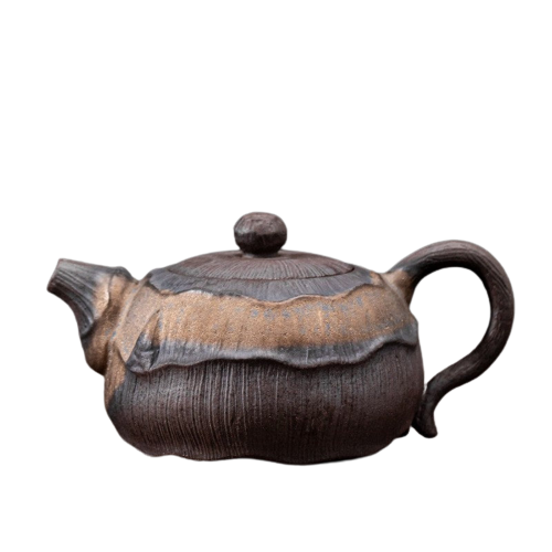 A brown ceramic teapot with a floral pattern on the lid and a handle on the side.