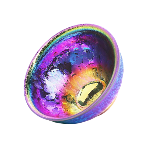 A multicolored, round ceramic teapot with a glossy finish and a central golden ring.