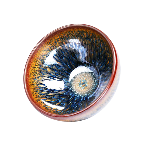 A round ceramic tea cup with a geocentric pattern featuring blue and brown colors and a visible spiral structure in the center.