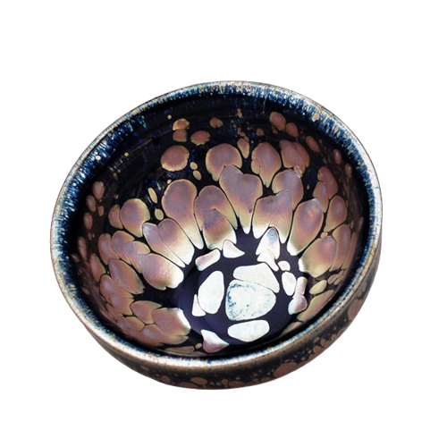 A ceramic tea cup with a sunset-like pattern in peach and moss green colors.