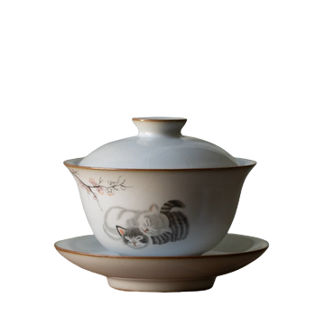 A white ceramic tea cup with a floral and cat design, including a lid and a saucer.