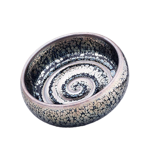 A swirling patterned ceramic tea cup.