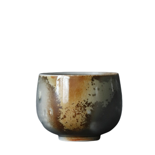 A ceramic tea cup with a brown and black color pattern, showing signs of rust and age.