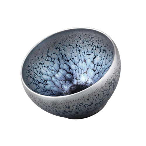 A round, blue and gray tenmoku tea cup with a textured surface.