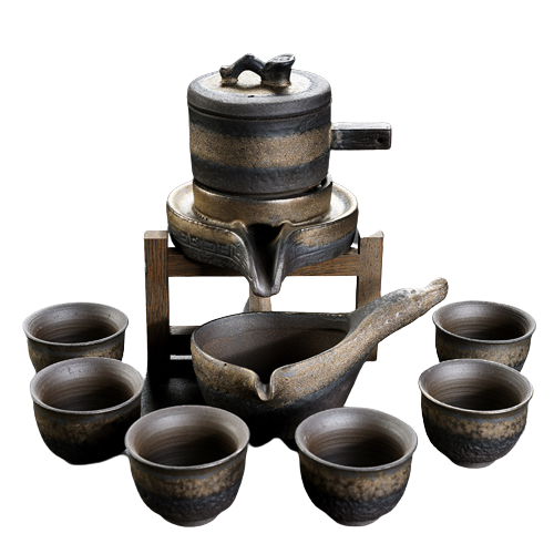 A set of brown ceramic tea set items, including a pot and several cups, with a textured artistic glaze.