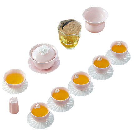 A pink Sakura tea set with cups and a pot, traditionally used for making tea, displayed on a surface.