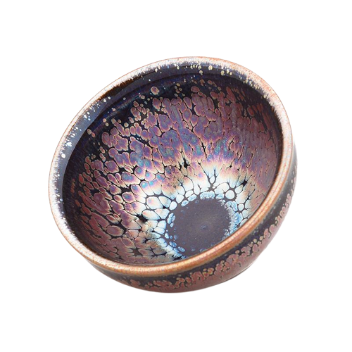 A round, high-temperature fired ceramic teapot with a mottled multicolor finish and a central, eye-like pattern.